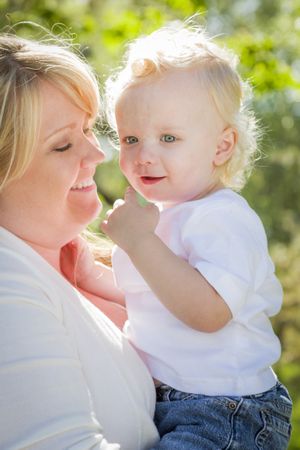 Young Mother Holding Her Adorable Baby Boy