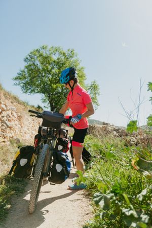 Woman riding bicycle in forest