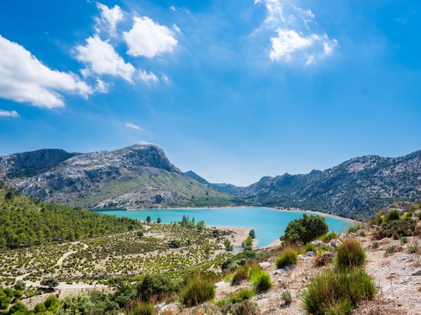 Lake surrounded by mountain ridge