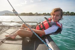 Content child smiling during cruise on yacht