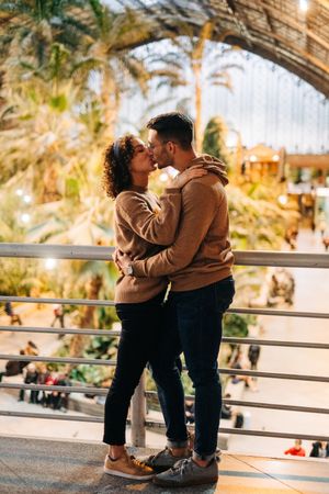 Happy couple hugging in pavilion
