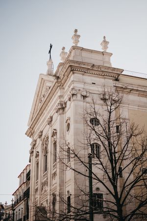 Corner of building against cloudy sky