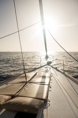 Seats on nose of yacht on water