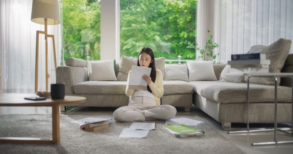 Portrait of a Korean Female Focused on Virtual Work from Home, Using Laptop Computer for Productive Task Management