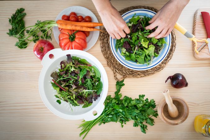Woman preparing vegetable salad