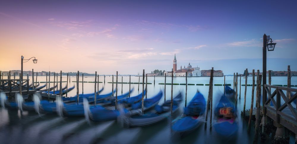 Venice lagoon, San Giorgio church and gondolas at sunrise, Italy