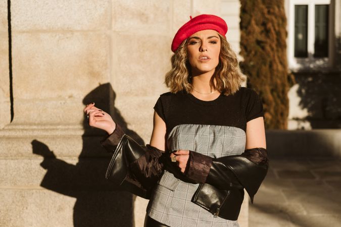 Stylish female in beret looking at camera