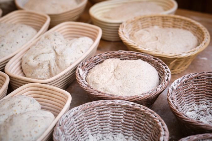 Leavened bread dough in baking pans