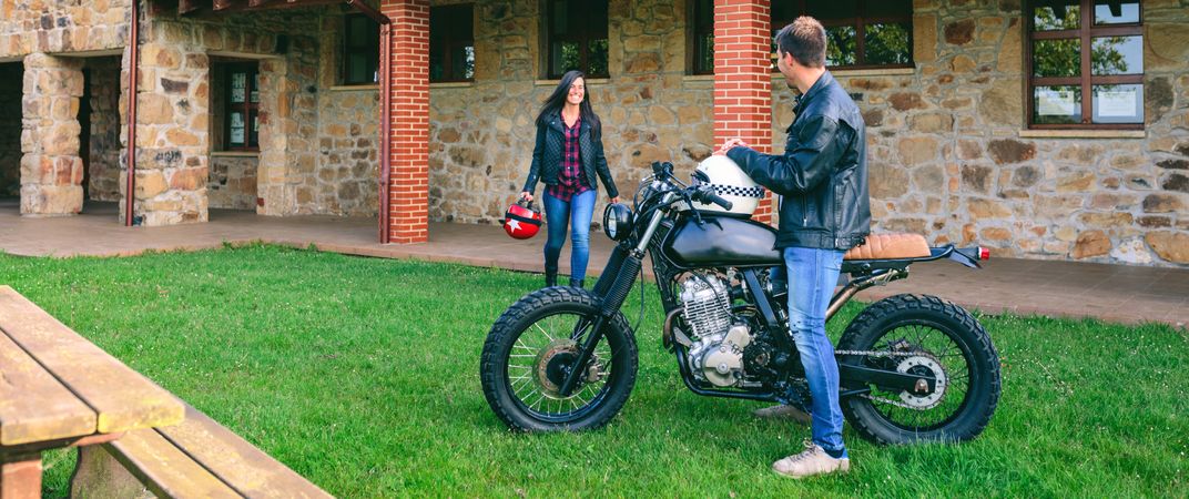 Man waiting his girlfriend on motorcycle