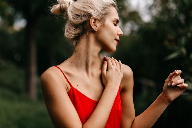 Dreamy young woman in summer garden