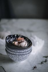 Garlic cloves in colorful bowl for vigil potaje