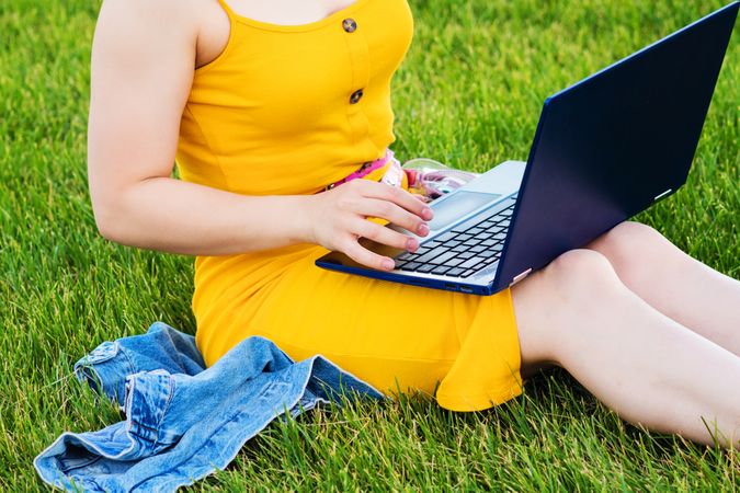 Unrecognizable woman with a laptop