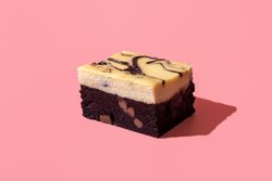 Cheesecake brownie minimalist on a pink background