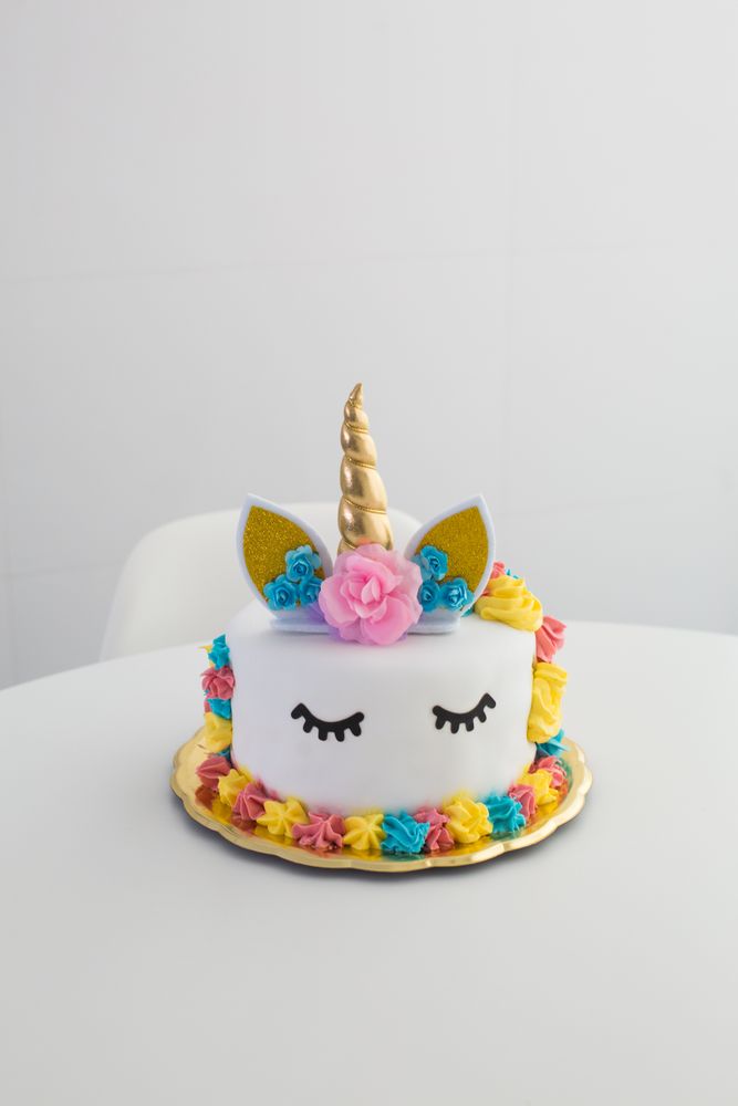 Cute unicorn cake with painted closed eyes