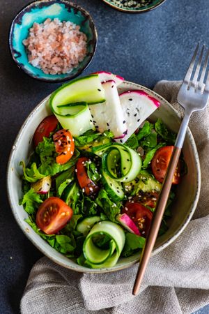 Healthy vegetable salad on rustic background