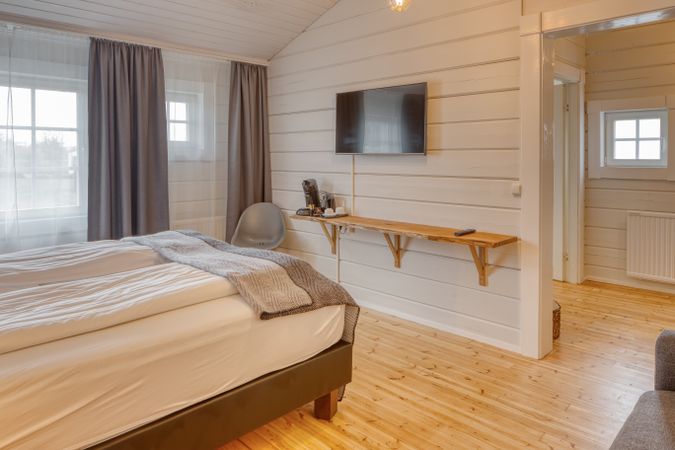 Cozy interior of bedroom with sofa