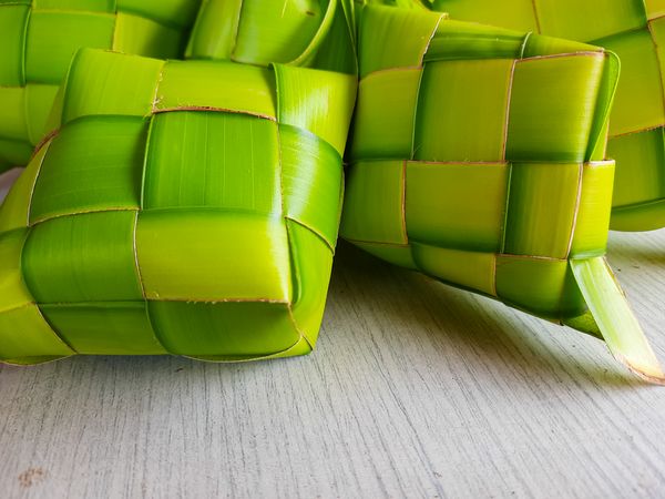 Woven from green coconut fronds, a traditional Indonesian food