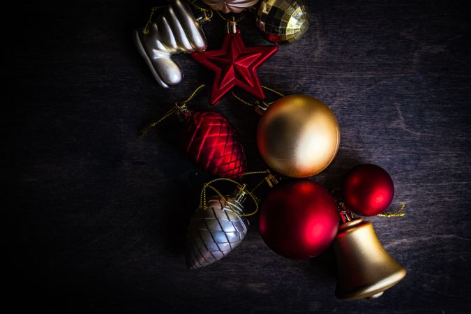Red & Golden Christmas baubles on wooden background