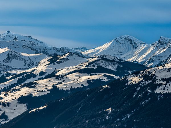 Swiss Alps winter landscape with snow and sun, mountains in Europe