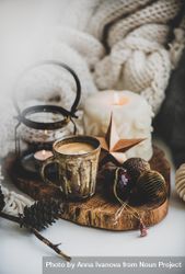 Coffee, candles, festive decorations against woolen blanket bxjGB5