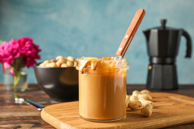 Yummy breakfast composition on wooden table against light background, space for text. Traditional product of American cuisine