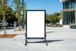 Metal a-frame mockup outside restaurant on street outside modern office building