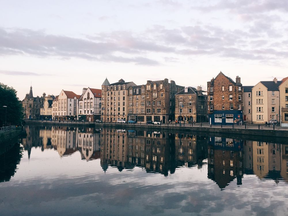 Buildings along a canal in late afternoon sunshine