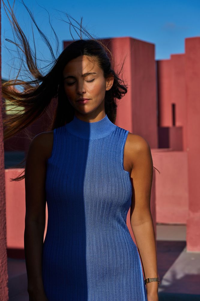 Woman with closed eyes in sunlight