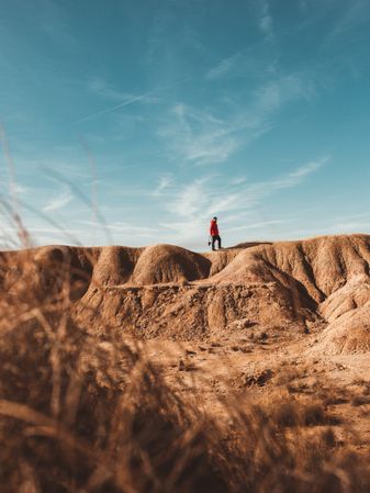 Tourist on sandy canyon hills