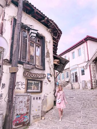 Woman walking in an alley