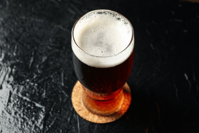 Glass of beer on table, close up