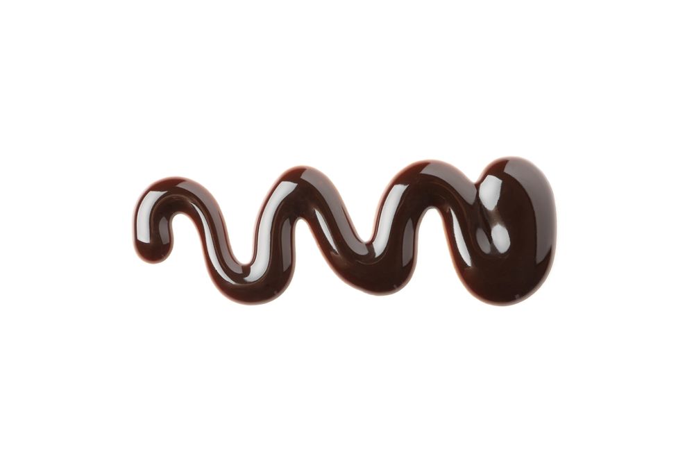 Melted chocolate isolated on blank background. Chocolate sauce