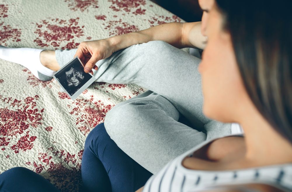Couple looking at ultrasound of their baby