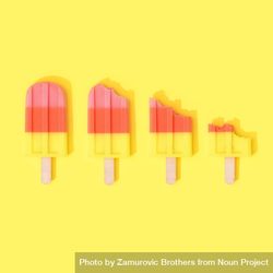 Row of ice cream popsicles on bright yellow background 0gm6l4