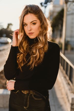 Stylish woman standing near metro station