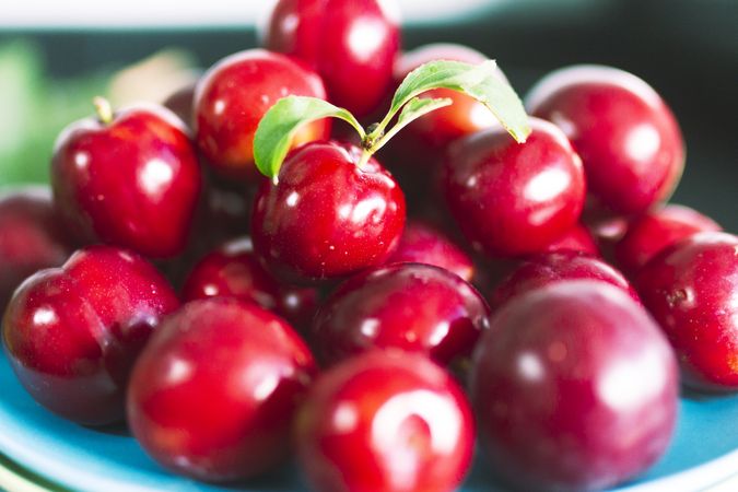 Fresh cherries with green leaf