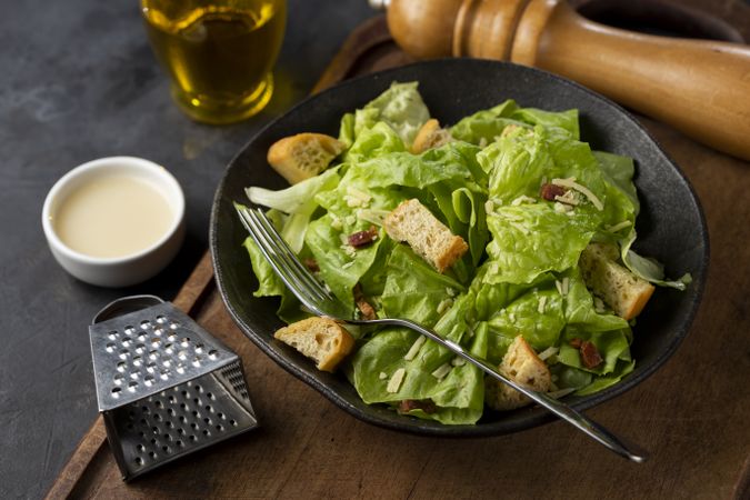 Caesar salad with croutons and bacon.