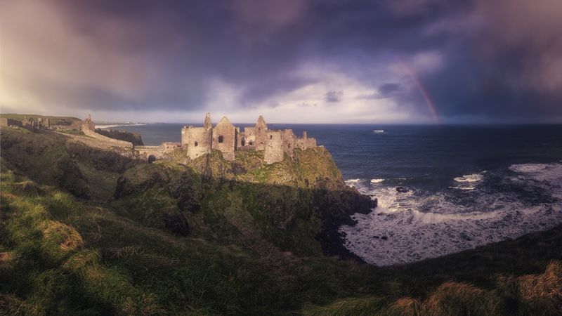 Ruins of medieval castle on cliff in Northern Ireland
