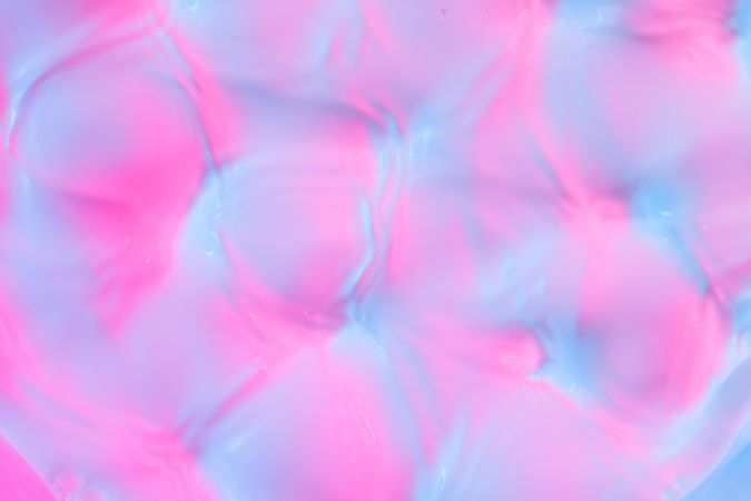 Ripples lit with vibrant bold gradient holographic colors