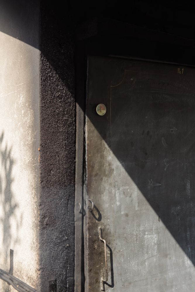 Closed metal door in shadow
