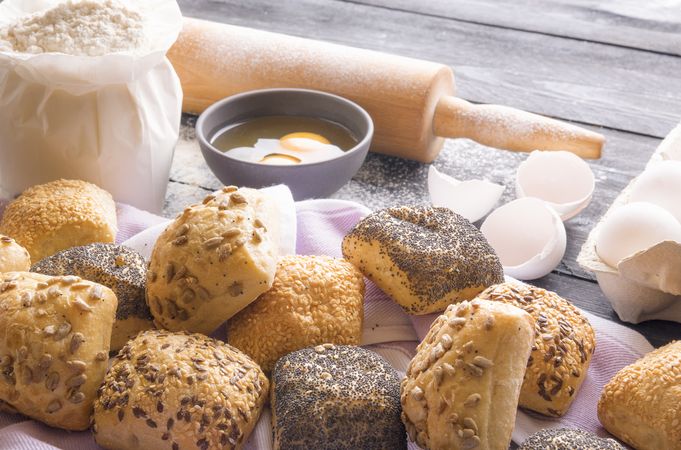 Freshly baked bread rolls and ingredients