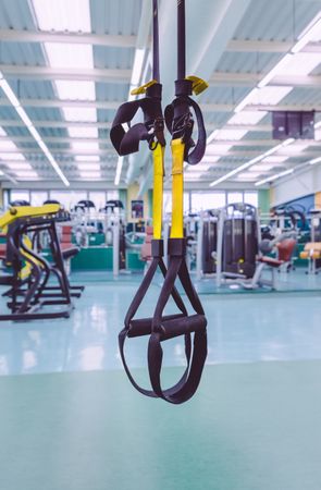 Yellow suspension ropes in gym