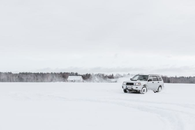 Car driving on snow field