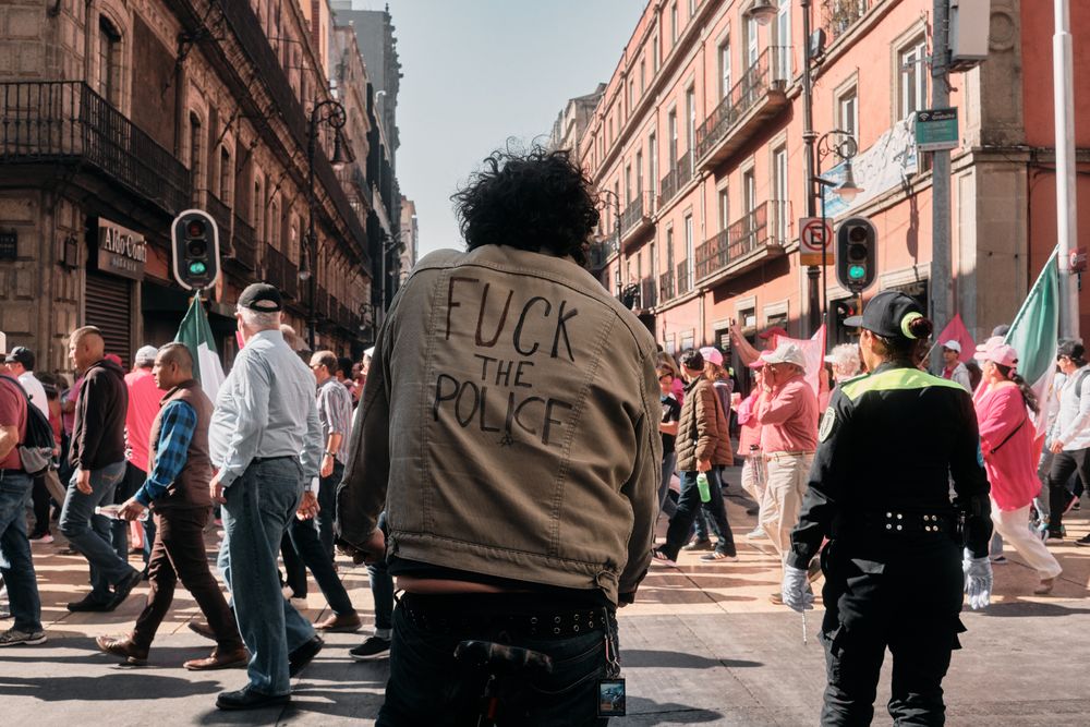 Mexico City, Mexico - February 26th, 2022: Male sitting on bike in street during protest