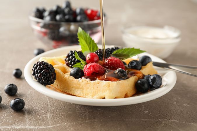 Composition of breakfast with belgian waffle, space for text