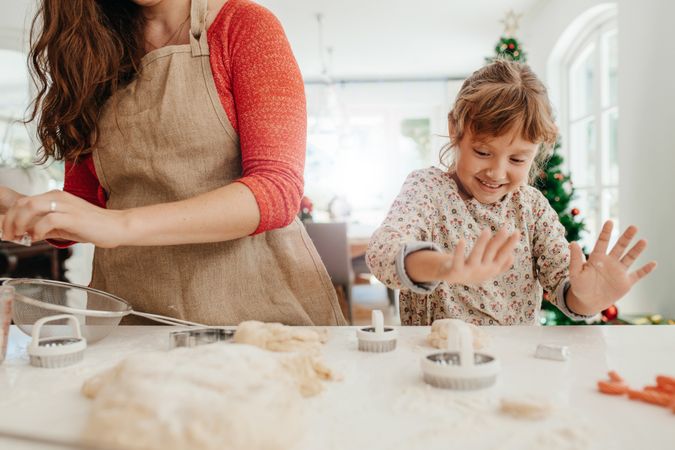 Mother and daughter baking for Christmas