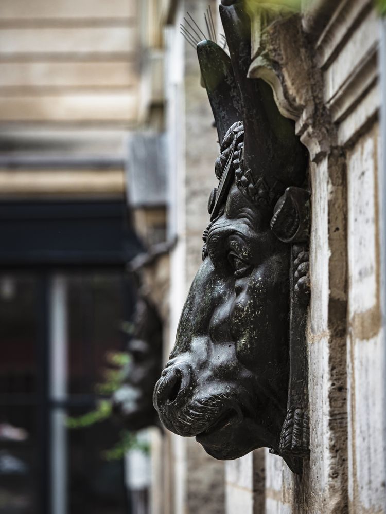Ancient sculpture in one of the churches of Paris. Antique art.