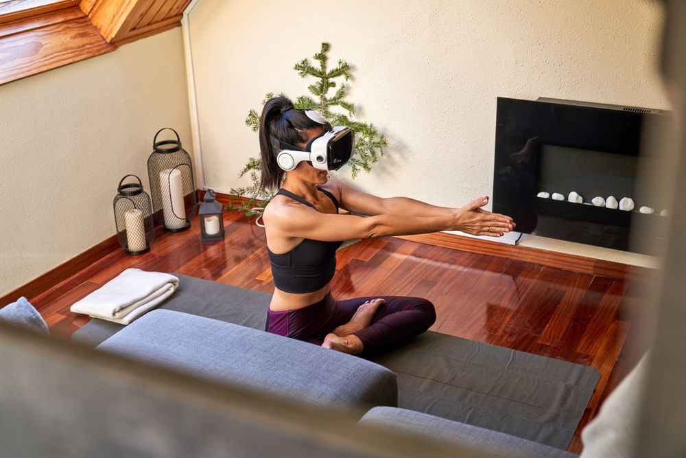 Female sitting with crossed legs and outstretching raised arms