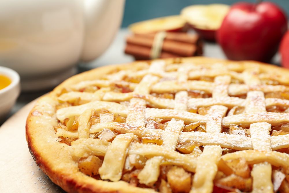 Composition with apple pie and ingredients, close up. Homemade food