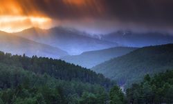 Sunset over hilly terrain